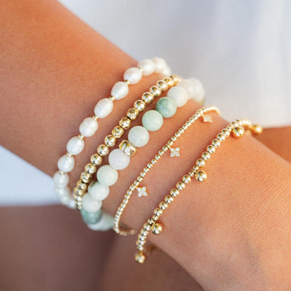 Burmese Jade 6mm gemstone strand from Earthly Abundance, showcasing smooth, polished green jade beads.