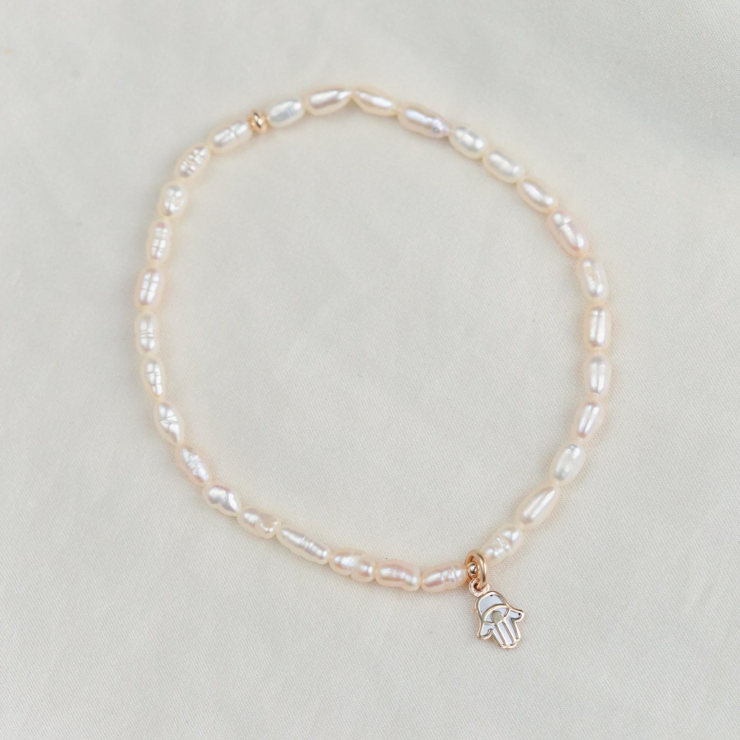 Feshwater pearl rondel with heart bead