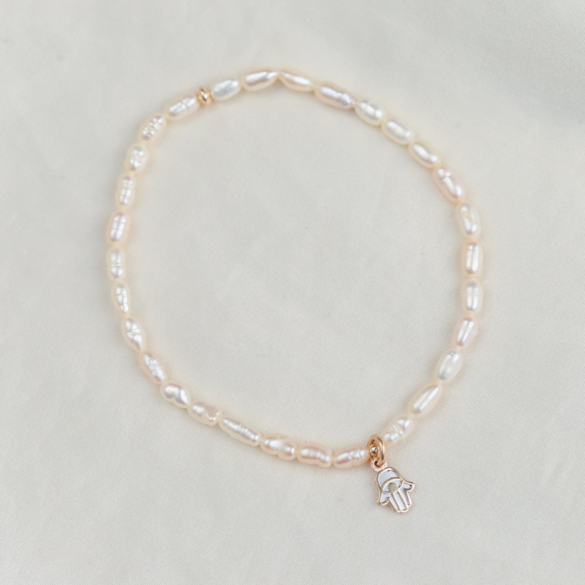 Feshwater pearl rondel with heart bead