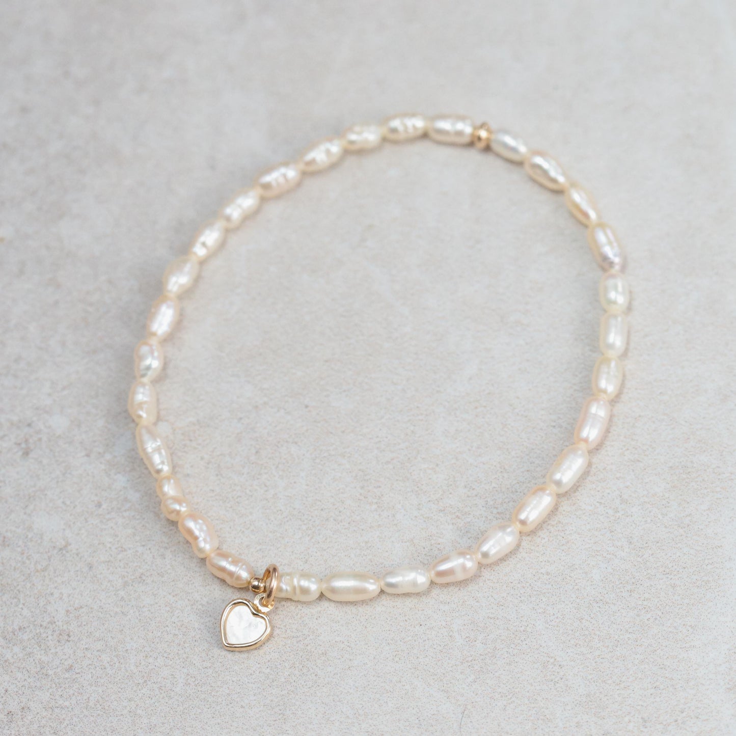 Feshwater pearl rondel with heart bead