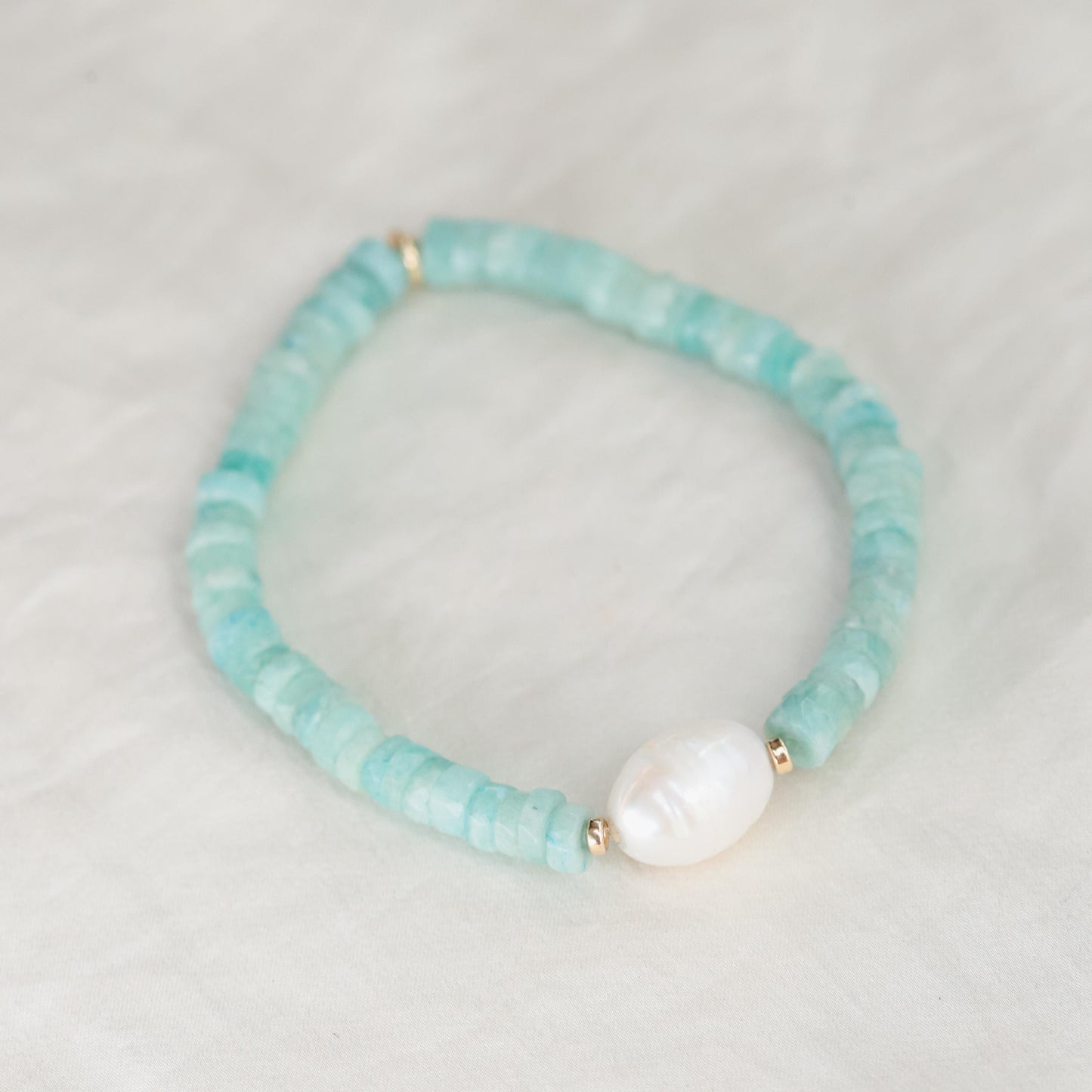 Heishi gemstone and pearl bracelet by Earthly Abundance featuring round beads and a delicate, natural design.