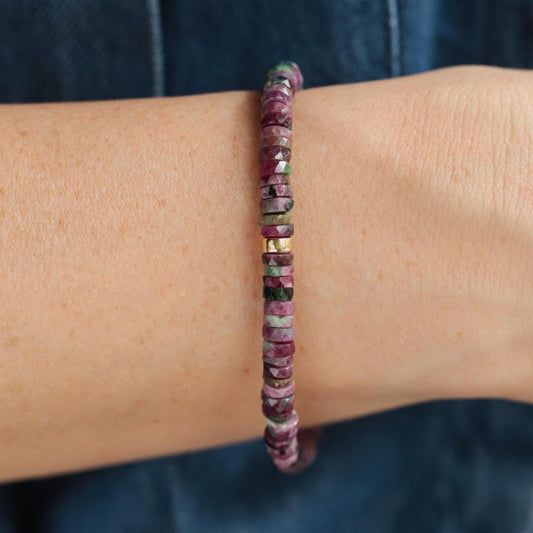Ruby Zoisite Heishi bracelet featuring small, colorful gemstone beads from Earthly Abundance on a plain background.