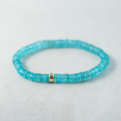Earthly Abundance Apatite Heishi bracelet with small blue-green gemstone beads and elastic stretch band.