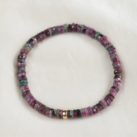 Ruby Zoisite Heishi bracelet featuring small, round gemstone beads in vibrant red, green, and black tones from Earthly Abundance.