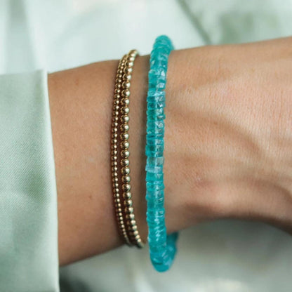 Earthly Abundance Apatite Heishi bracelet with small blue gemstone beads and adjustable cord for a casual, boho accessory.