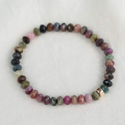 Mixed tourmaline bracelet by Earthly Abundance featuring multicolored gemstone beads on a stretch cord.