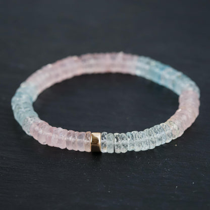 Pastel Morganite Beryl Heishi bracelet with round gemstone beads, featuring soft pink and peach tones, on a white background.