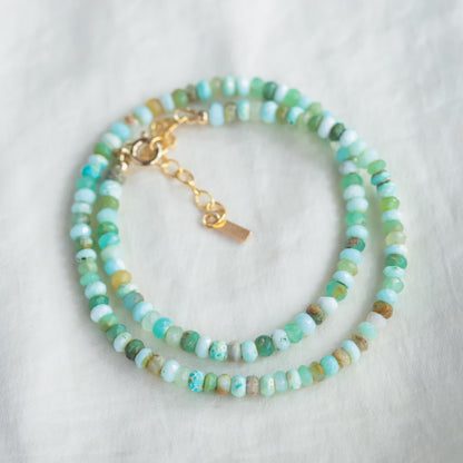 Peruvian opal necklace with vibrant blue and green stones on a silver chain, natural and elegant jewelry by Earthly Abundance