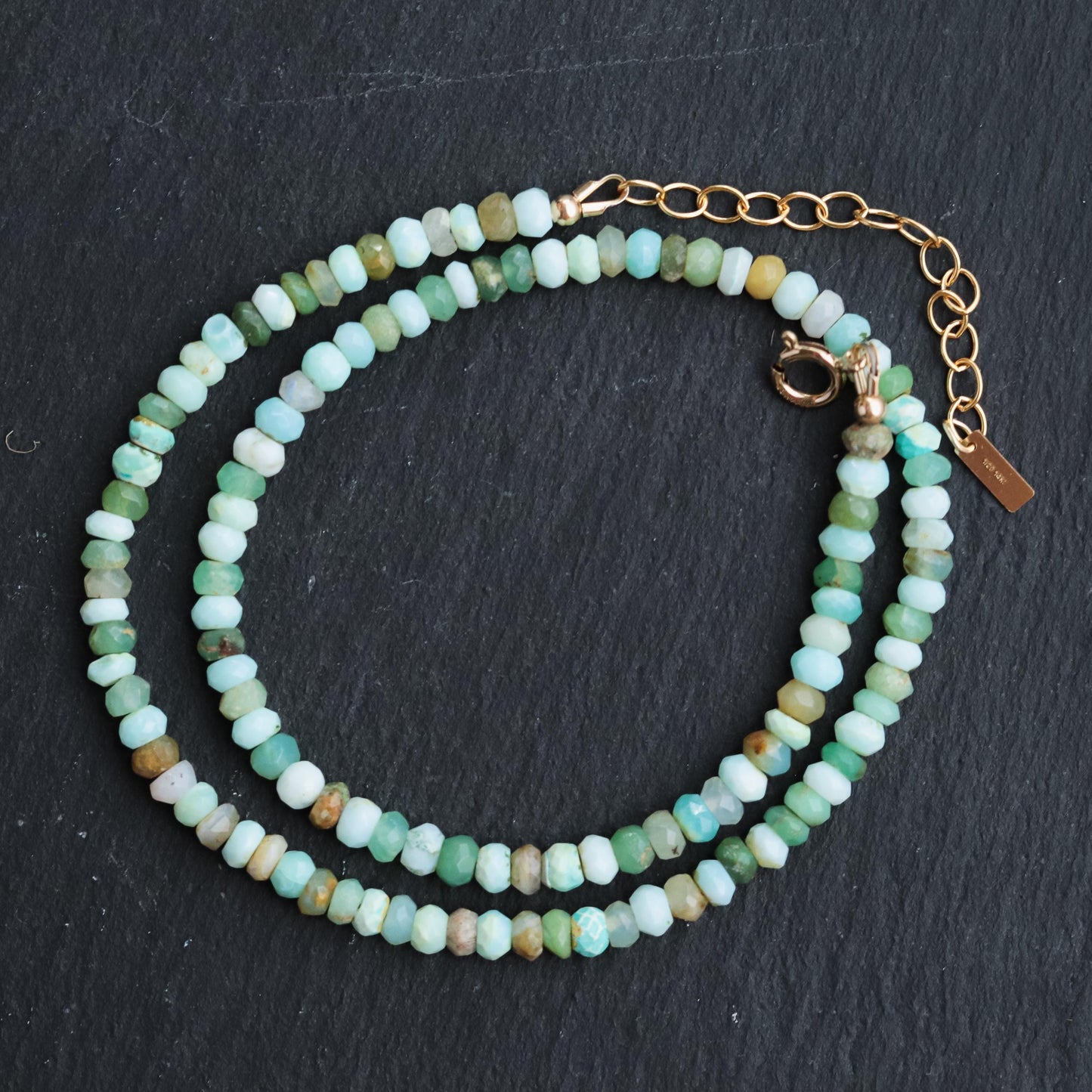 Peruvian opal necklace with polished gemstone beads and silver clasp, crafted by Earthly Abundance.