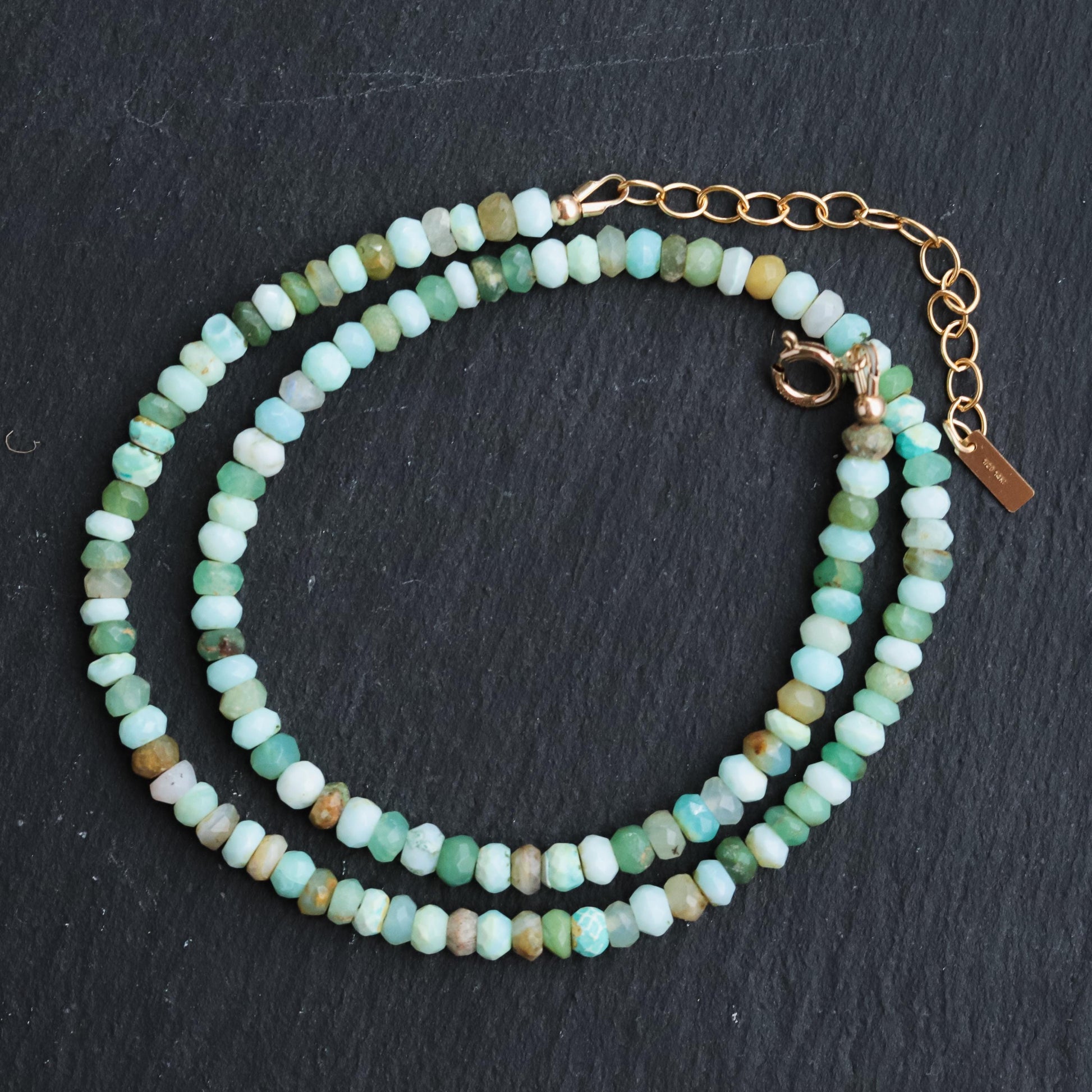 Peruvian opal necklace with polished gemstone beads and silver clasp, crafted by Earthly Abundance.