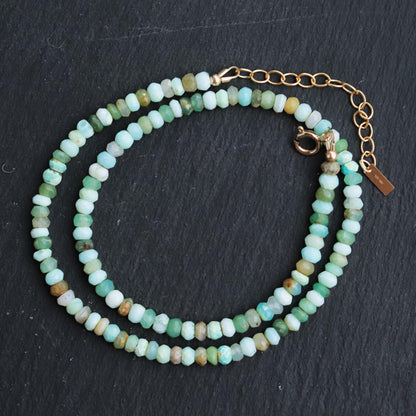 Peruvian opal necklace with polished gemstone beads and silver clasp, crafted by Earthly Abundance.
