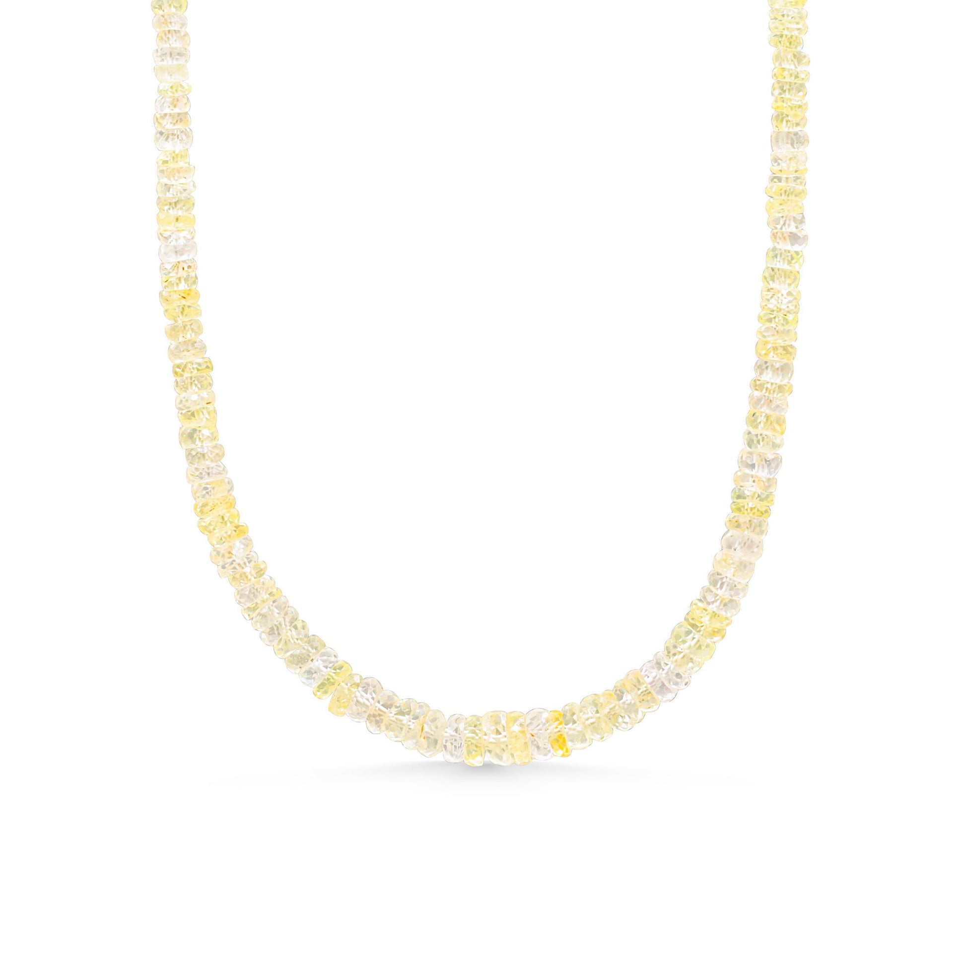 Yellow sapphire necklace with a gold chain from Earthly Abundance, featuring a vibrant yellow gemstone pendant.