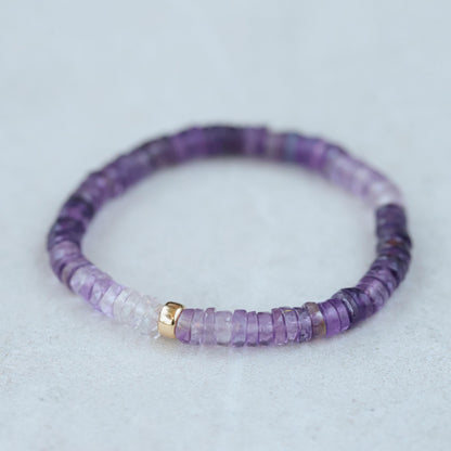 Radiant Ombré Amethyst Heishi bracelet by Earthly Abundance featuring colorful, layered amethyst beads on a flexible stretch band