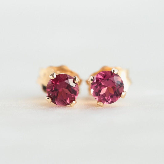 Pink tourmaline stud earring by Earthly Abundance featuring a sparkling pink gemstone set in a simple metal stud.