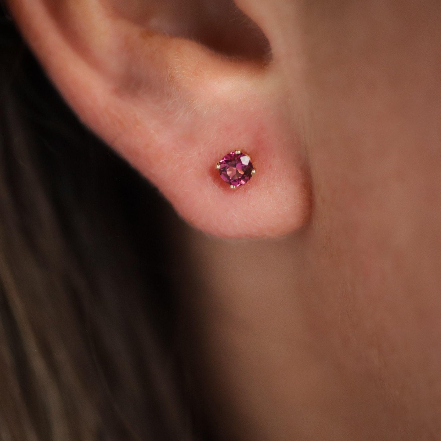 Pink Tourmaline stud earring by Earthly Abundance featuring a sparkling pink gemstone set in a silver stud.