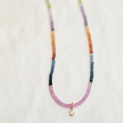 Multi sapphire necklace by Earthly Abundance featuring vibrant blue and pink sapphires on a delicate chain.