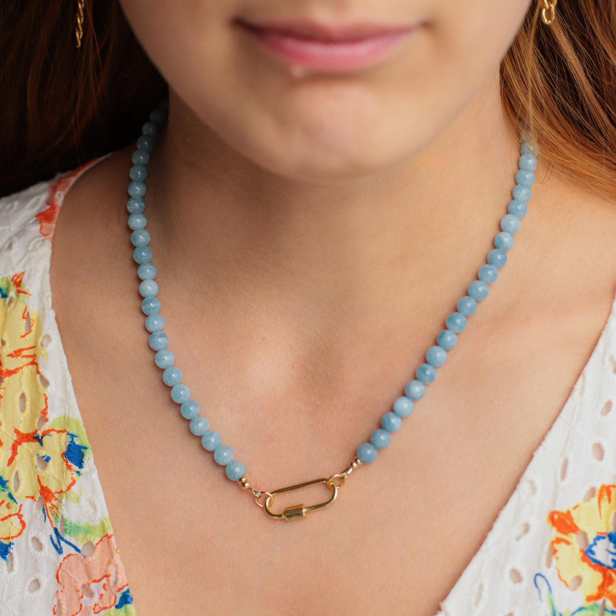 Aquamarine Carabiner Necklace by Earthly Abundance featuring a silver chain with a turquoise aquamarine pendant.