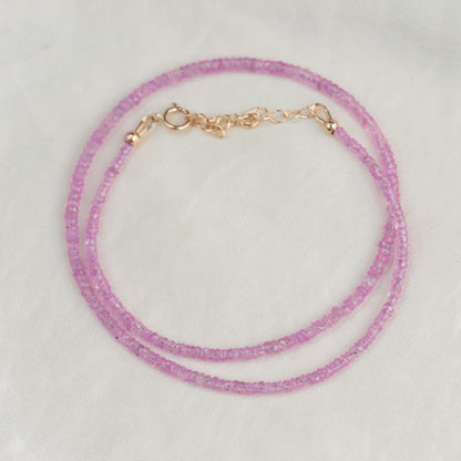 Pink sapphire necklace from Earthly Abundance featuring a string of vibrant pink sapphires on a delicate chain.