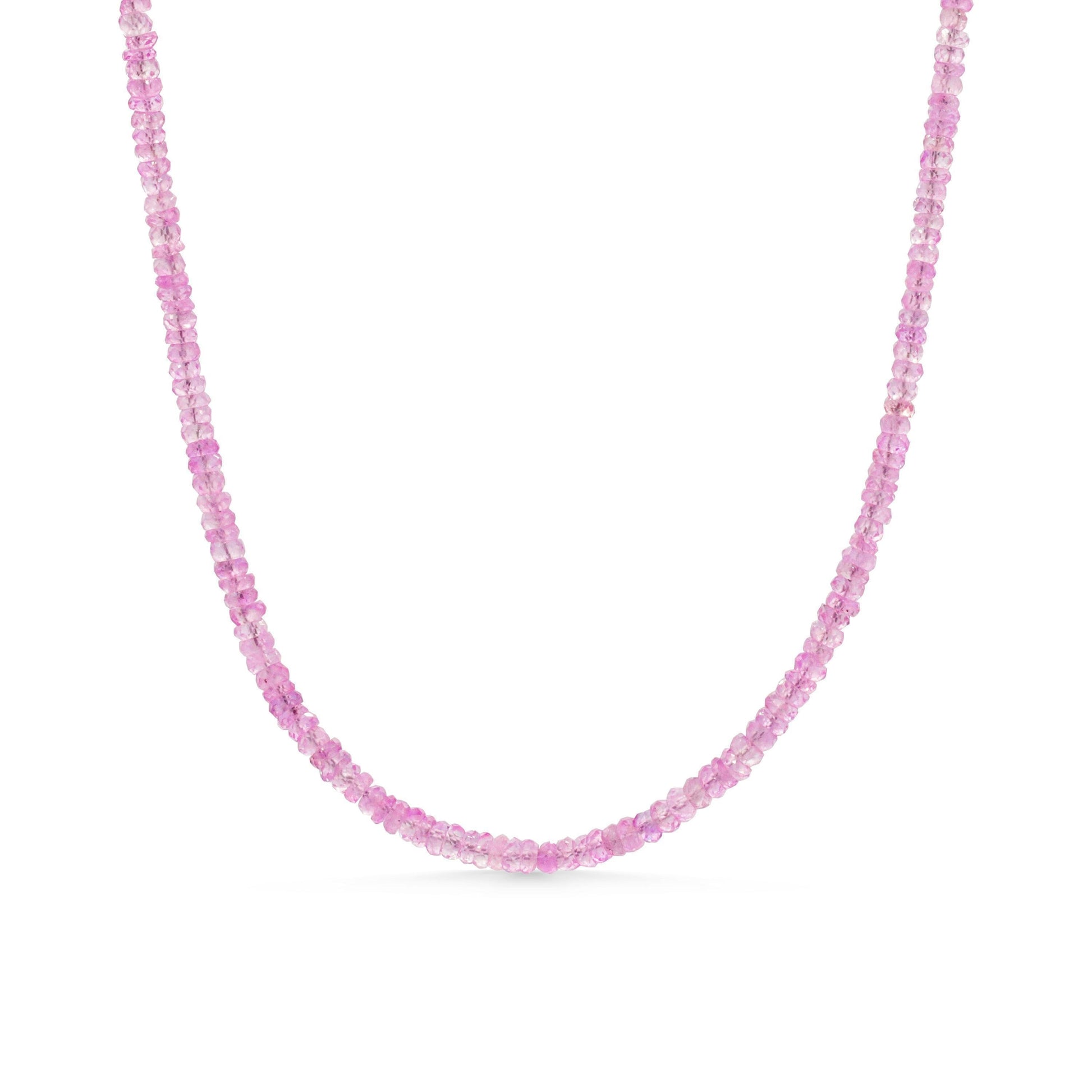 Pink sapphire necklace by Earthly Abundance featuring a delicate chain with vibrant pink sapphires and elegant design.