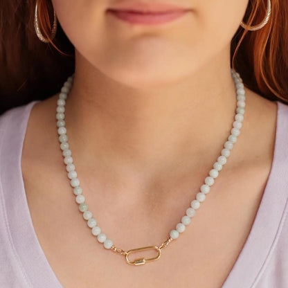 Elegant jadeite necklace featuring smooth green beads from Earthly Abundance, symbolizing harmony and protection.