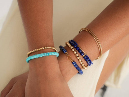 Lapis Lazuli bracelet featuring deep blue stones with gold flecks, crafted by Earthly Abundance Jewelry.