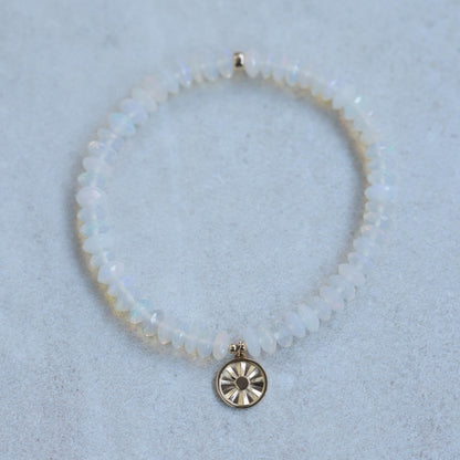 Ethiopian Welo Opal sun bracelet with 14K gold setting, featuring a radiant opal gemstone on a delicate gold chain.