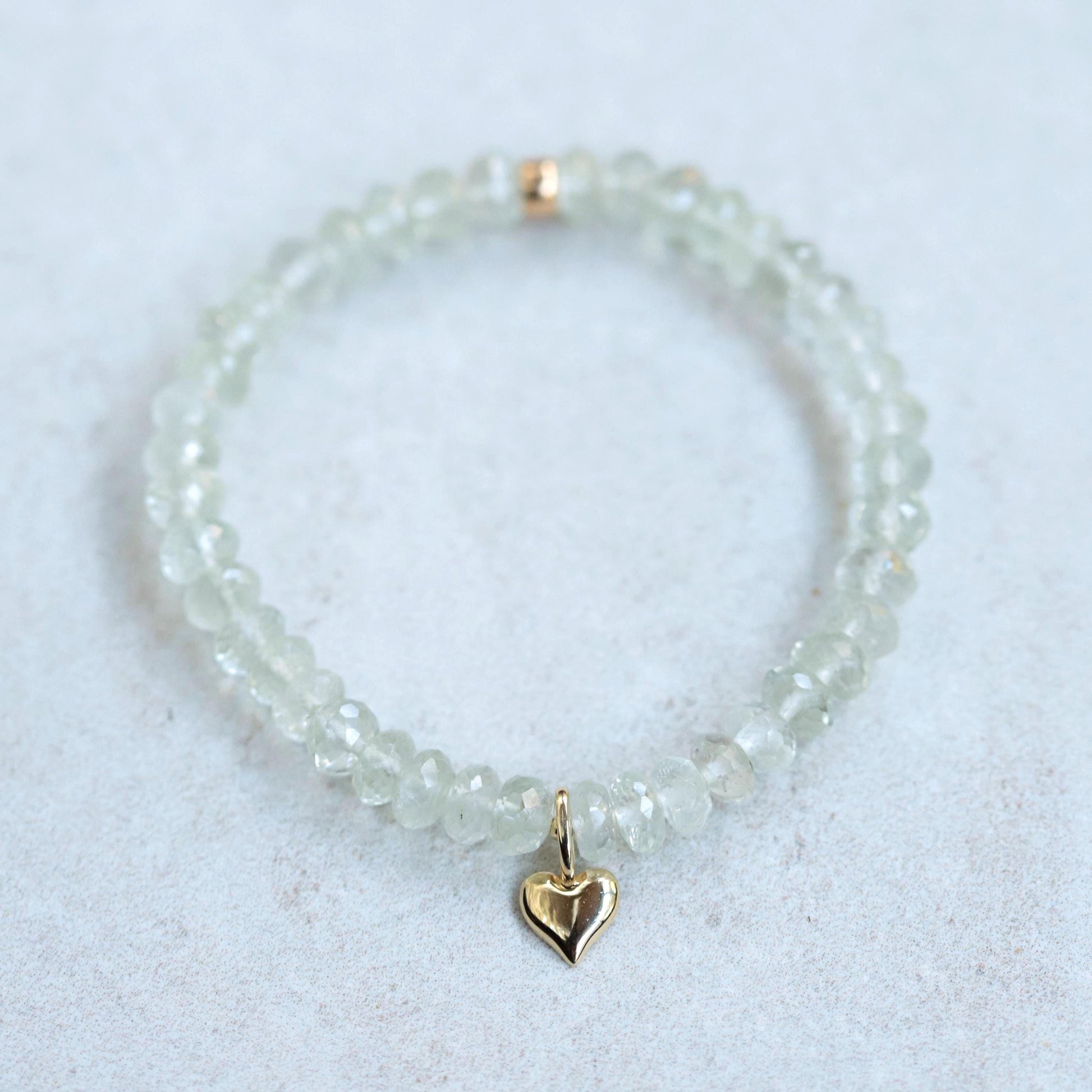 Earthly Abundance Aurelia Heart Bracelet featuring green amethyst gemstones on a delicate chain, showcasing elegant jewelry design.