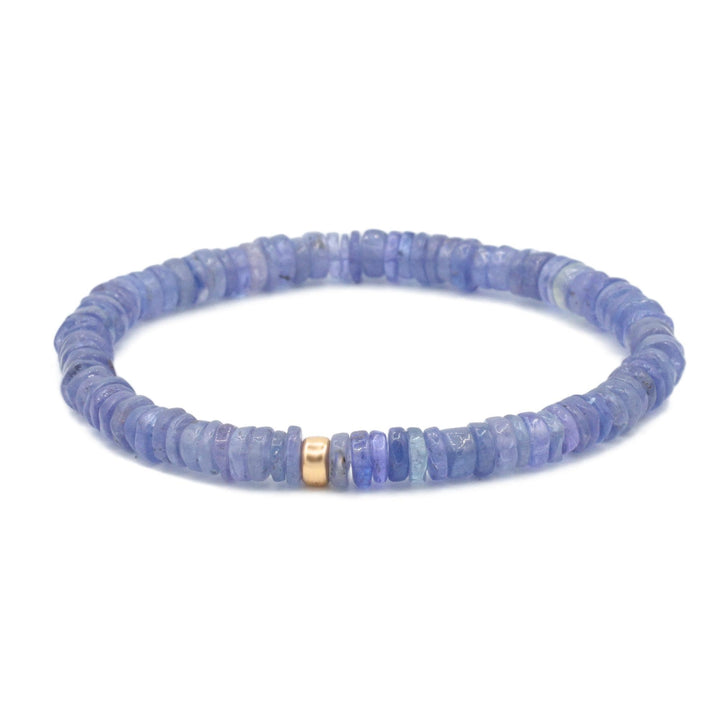 Earthly Abundance Tanzanite stretch bracelet featuring vibrant blue-purple tanzanite gemstones on an elastic band.