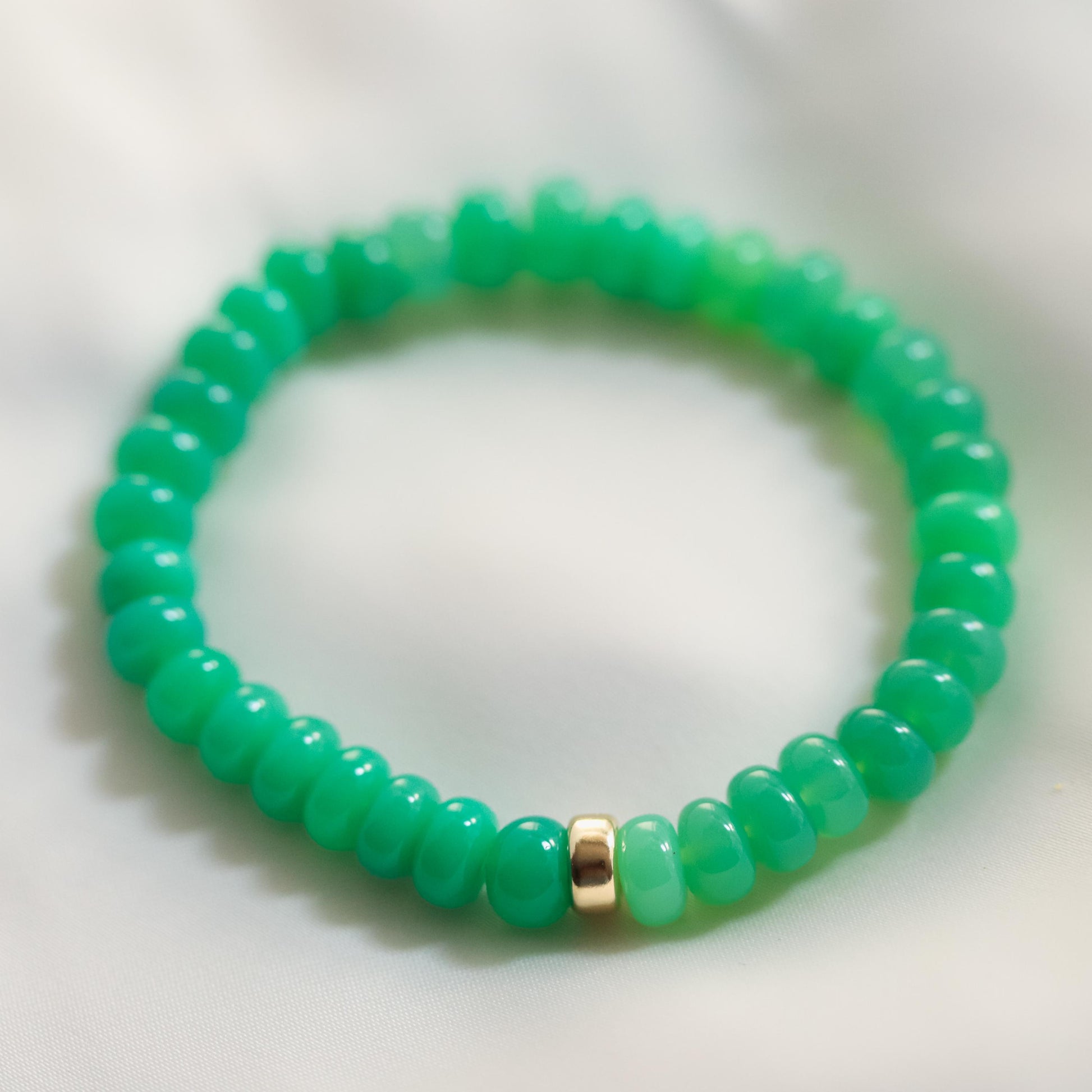 Apple green chalcedony bracelet from Earthly Abundance with round smooth gemstone beads and a silver clasp.