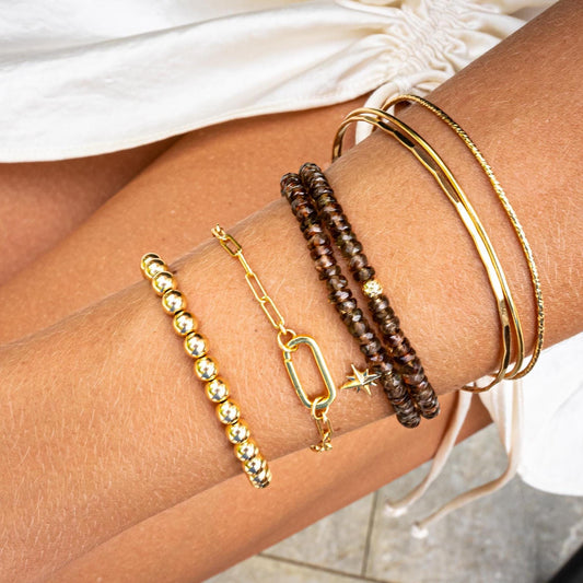 Earthly Abundance Andalusite bracelet featuring polished, multicolored stones on a delicate silver chain.