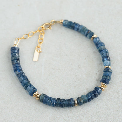 Kyanite Heishi bracelet with 14K gold-filled accents, featuring smooth round blue kyanite beads, handcrafted by Earthly Abundance.