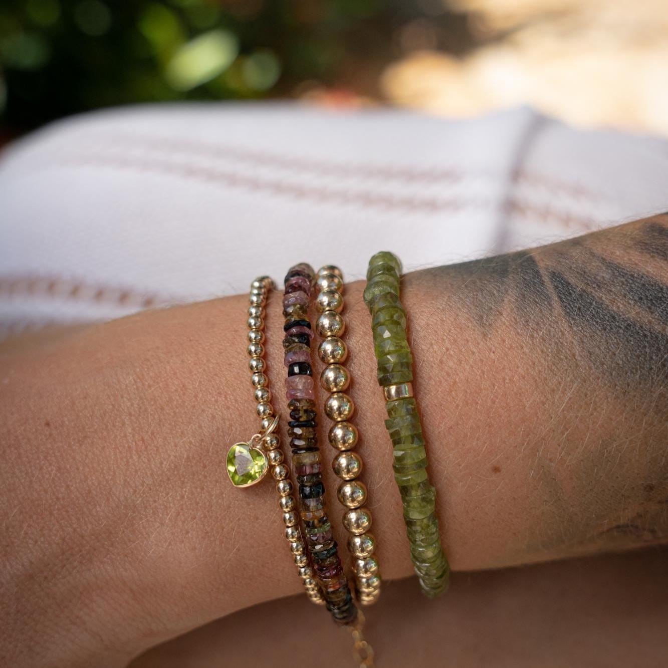 Earthly Abundance Vessonite Heishi bracelet featuring smooth, colorful gemstone beads on a stretch cord for a stylish, natural look.