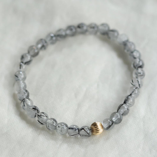 Black rutilated quartz with evil eye charm