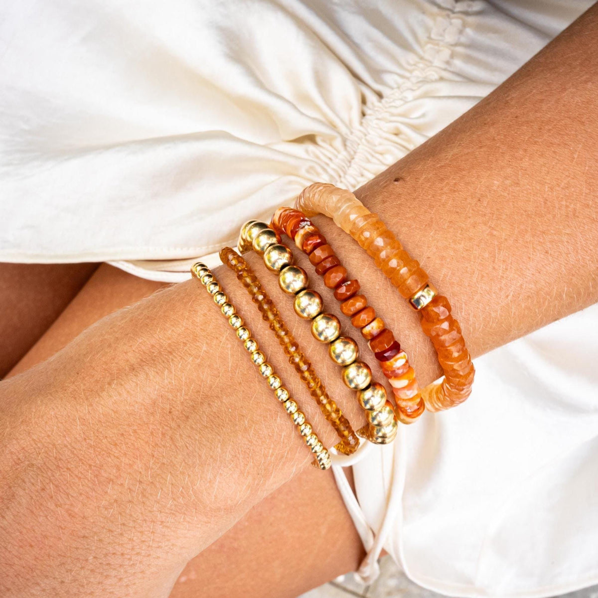 Golden Light Citrine Bracelet by Earthly Abundance featuring polished citrine beads on an elastic band.