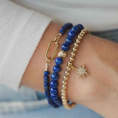 Lapis Lazuli bracelet with 14K gold accents from Earthly Abundance, featuring deep blue stones and gold clasps.