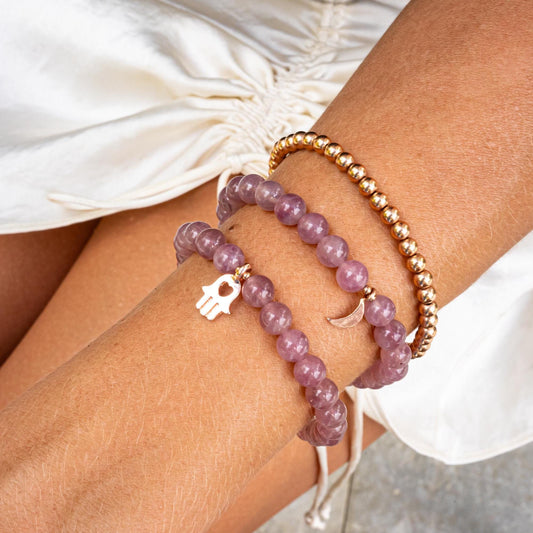 Madagascar Rose Quartz bracelet by Earthly Abundance featuring pink gemstone beads on an elastic stretch band.