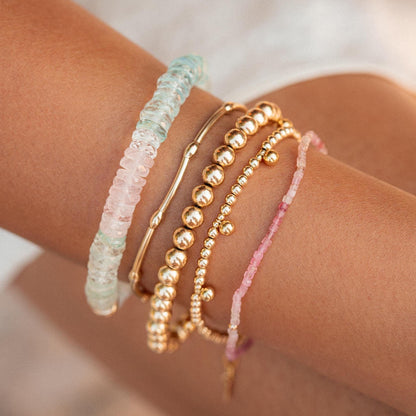 Pastel Morganite Beryl Heishi bracelet by Earthly Abundance featuring soft pink and green gemstone beads on a delicate string.