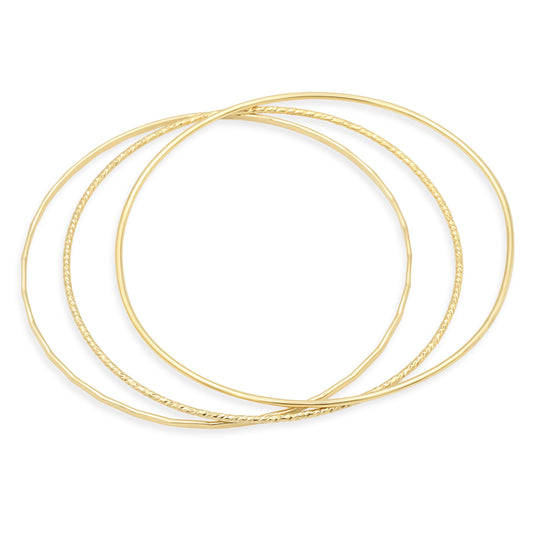 Set of gold-filled bangles featuring smooth, hammered, and sparkly finishes, showcasing elegant jewelry by Earthly Abundance.