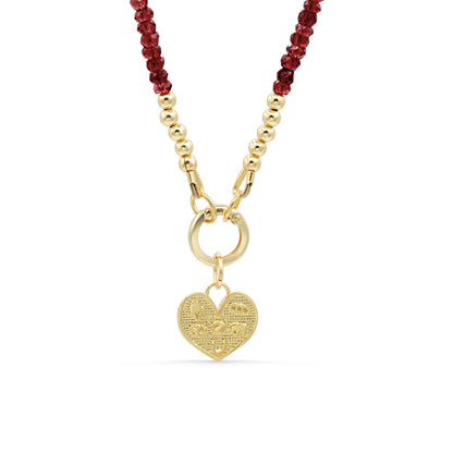 Earthly Abundance Amor Garnet necklace featuring a deep red garnet gemstone on a delicate chain.