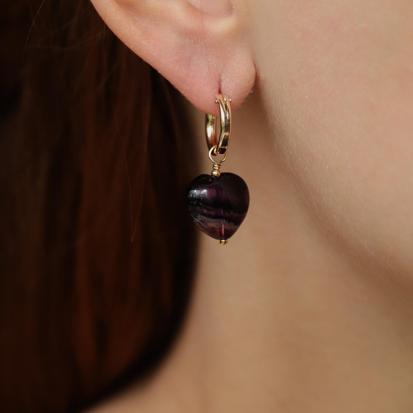 Green fluorite heart hoop earrings by Earthly Abundance featuring vibrant gemstone hearts and silver hoops.