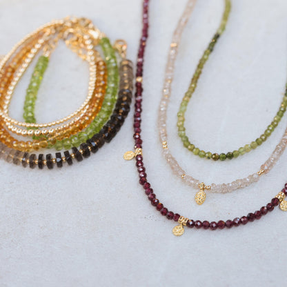 Earthly Abundance Timeless Radiance Zircon necklace featuring a delicate chain with sparkling zircon stones on a white background.