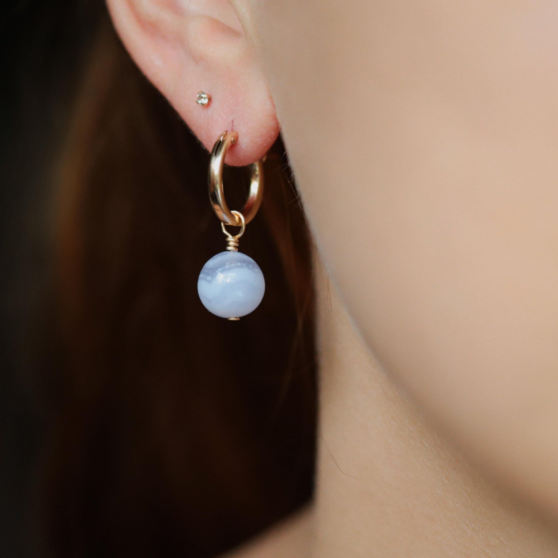 Blue lace agate hoop earrings with 14K gold-filled details, featuring delicate lace patterns and a polished finish.