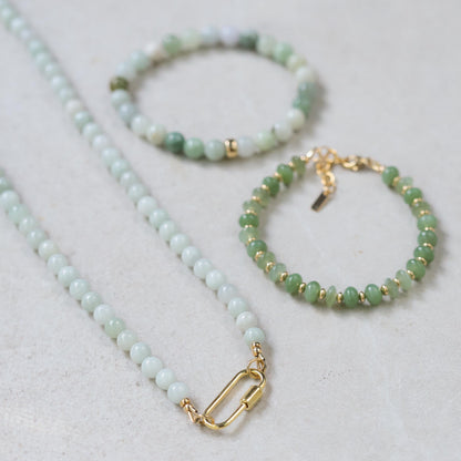 Burmese Jade 6mm beads from Earthly Abundance, showcasing smooth, polished green jade gemstones arranged in a string.