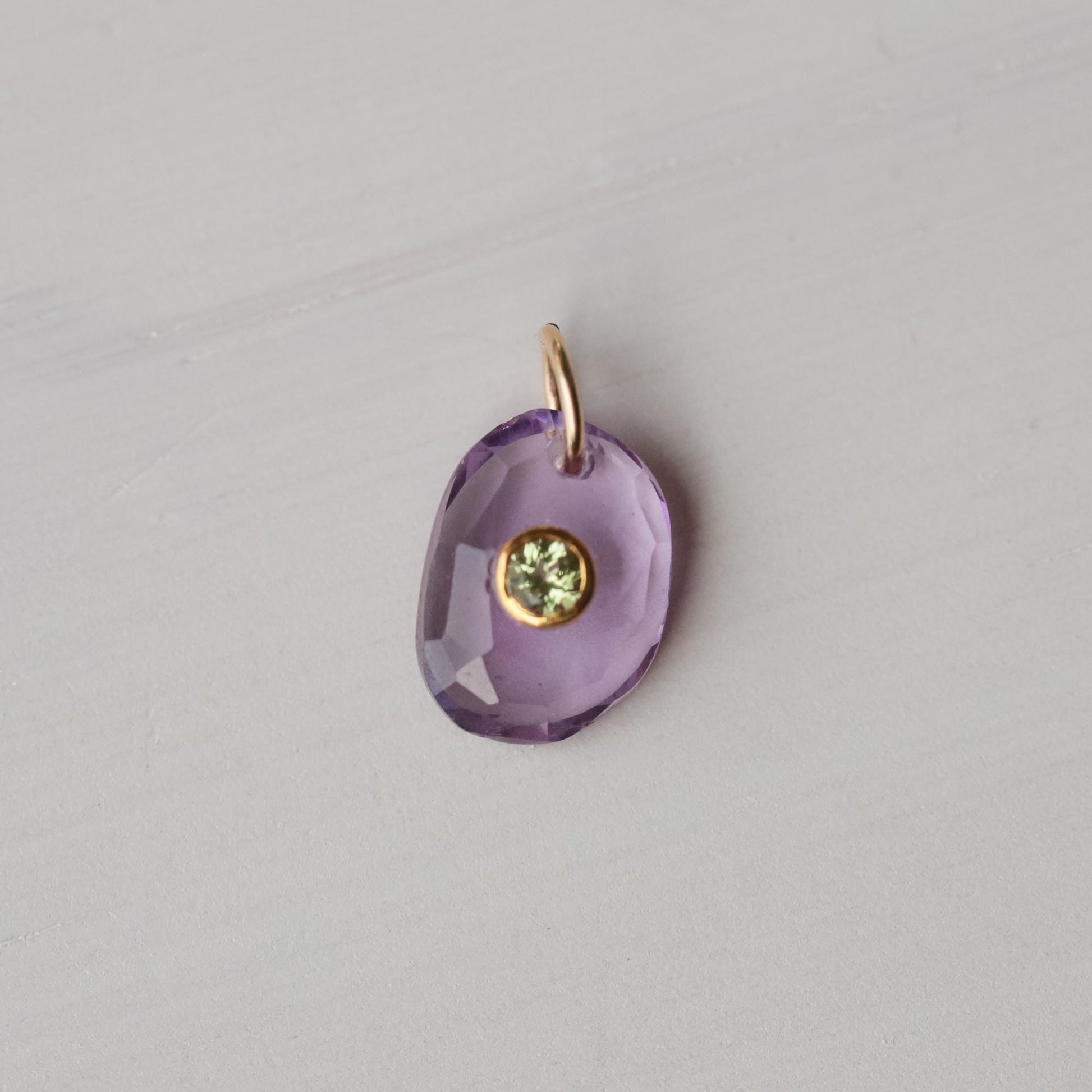 Wild Iris Pendant featuring Amethyst and Peridot gemstones by Earthly Abundance, showcasing a floral-inspired jewelry design.