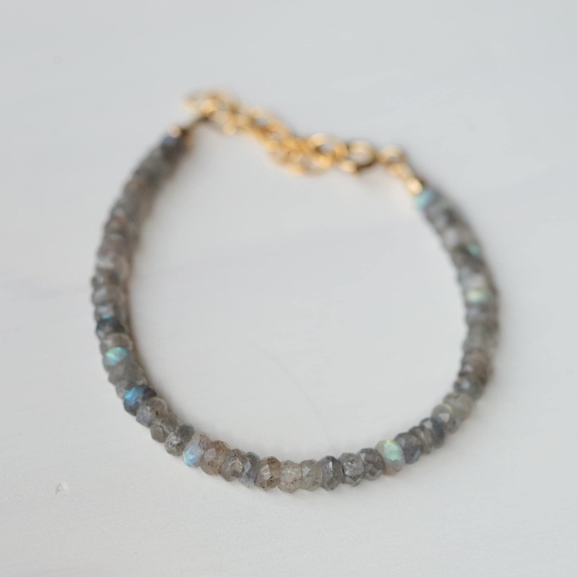 Labradorite protection bracelet from Earthly Abundance featuring polished Labradorite stones on an elastic band.