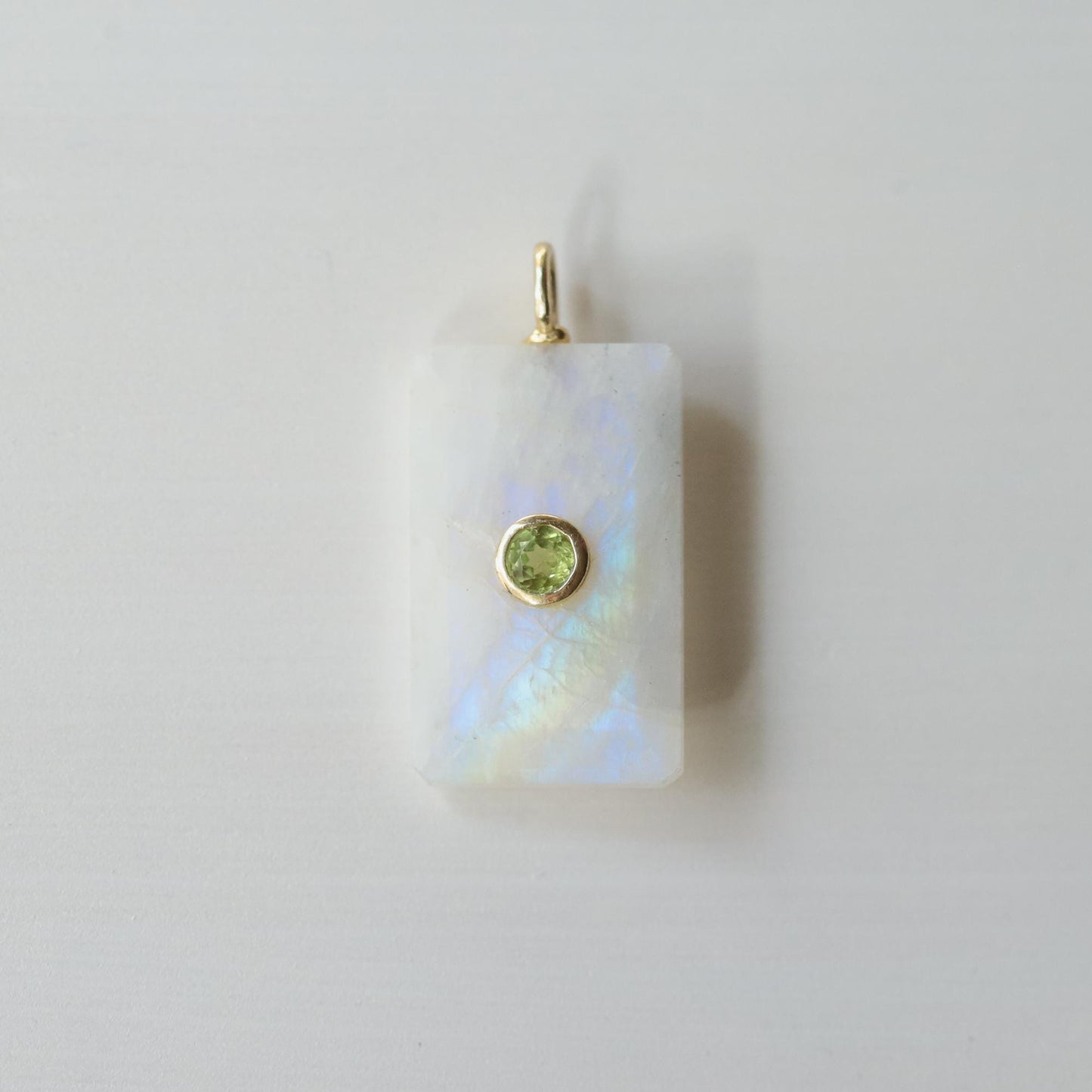 Earthly Abundance Moonlight Bar Moonstone pendant showcasing a sleek, elongated moonstone gemstone on a silver chain.