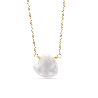 Elegant Etherea Pearl Necklace by Earthly Abundance featuring lustrous white pearls on a delicate chain.
