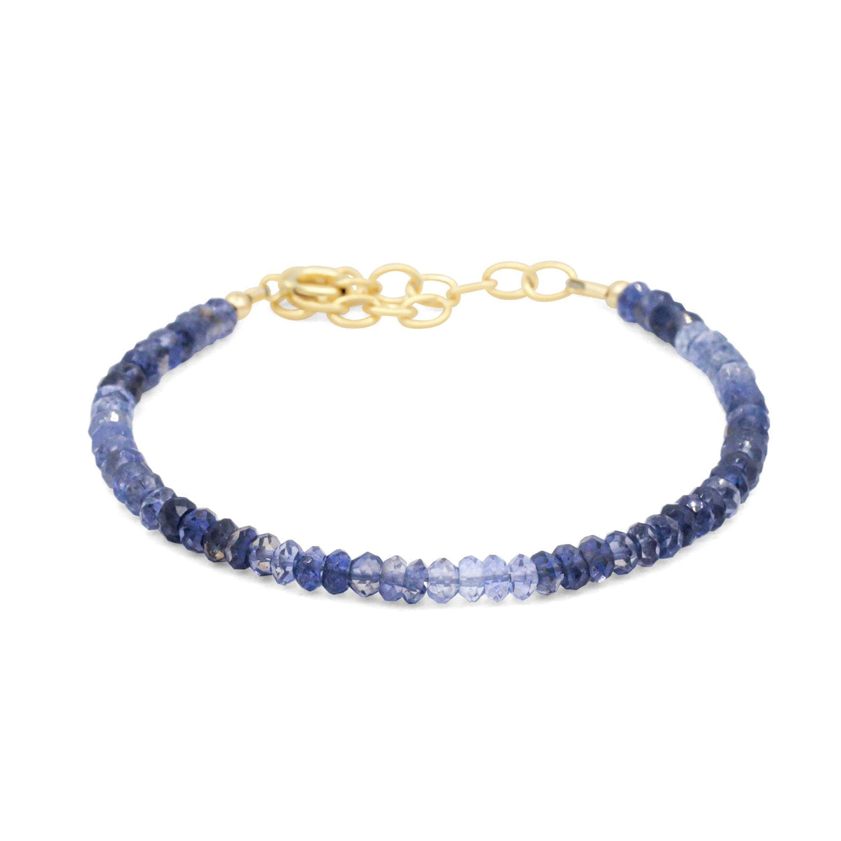Earthly Abundance Jewelry Inner Calm Iolite bracelet featuring smooth, polished blue violet Iolite stones on an elastic band.