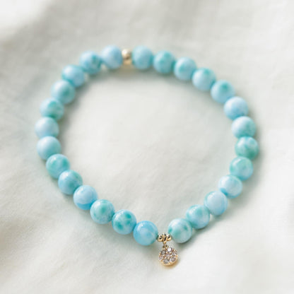 Larimar and diamond bracelet from Earthly Abundance featuring a delicate design with blue larimar stones and sparkling diamonds.