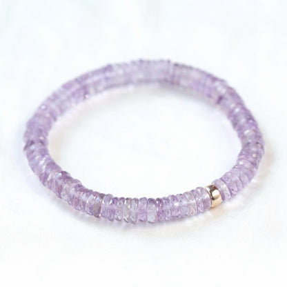 Ethereal pink amethyst heishi bracelet with small round pink beads, featuring a delicate and elegant jewelry design.